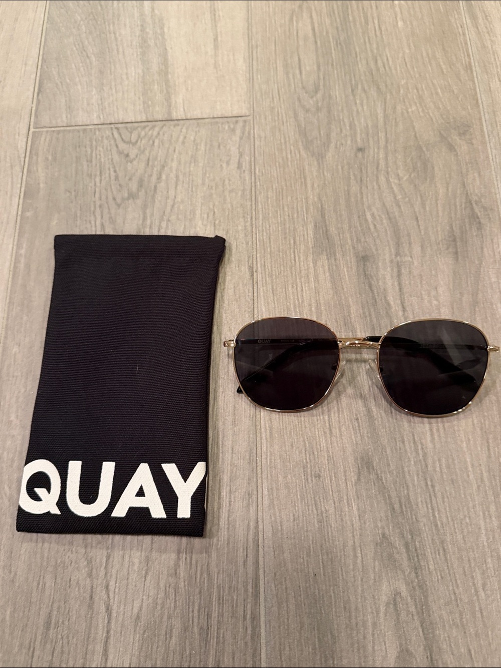Quay Woman’s Gold Frame Sunglasses with Black Lenses